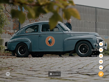 A man gets out of a blue car.